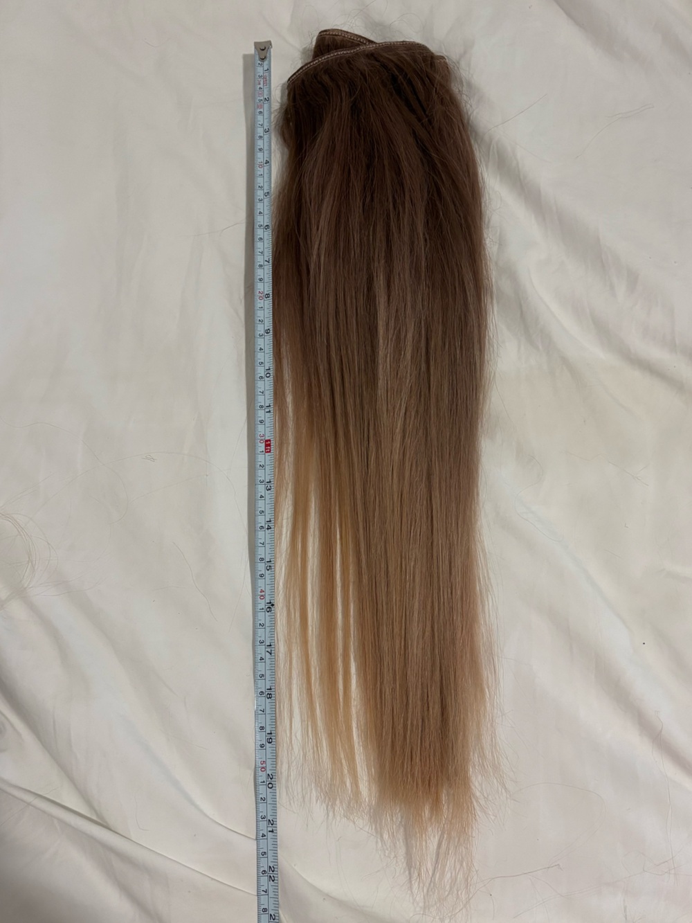 Straigh hair extensions. Brown to blonde highlighted ashy